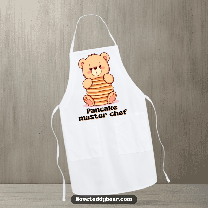 Funny apron with a chubby teddy bear attempting to balance pancakes, designed for kitchen fun and gifting.