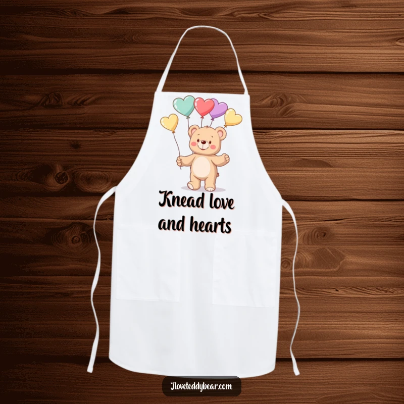 Funny Apron showing a cheerful teddy bear juggling a delightful mix of heart-shaped balloons while standing ready to cook or bake.