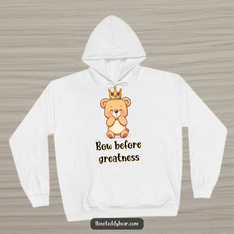 Funny hoodie showcasing a teddy bear with a crown, performing a dramatic bow, offering comfort and humorous, regal style.