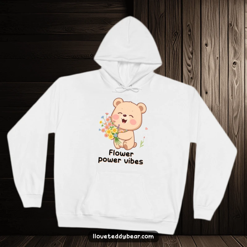 Funny hoodie featuring a bear chuckling contently while holding a bouquet of wildflowers, offering warmth and cheerful design.