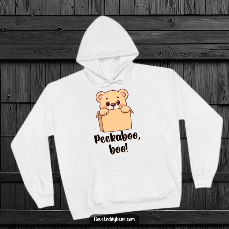 Funny hoodie featuring a teddy bear peeking from behind a box with a shocked expression, offering warmth and humor for recipients.