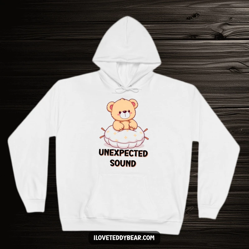 Funny teddy bear hoodie showing a bear looking surprised after accidentally sitting on a whoopee cushion, ready for fun.