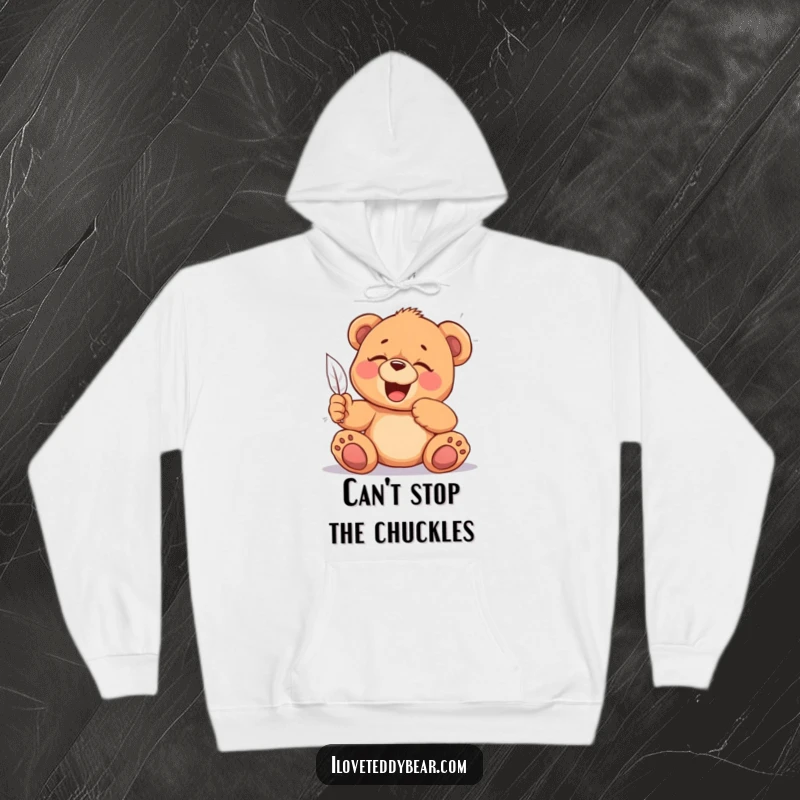 Funny Tickled Teddy Bear Hoodie: A soft hoodie featuring a giggling teddy bear being tickled by a feather, radiating pure joy, an excellent funny gift.