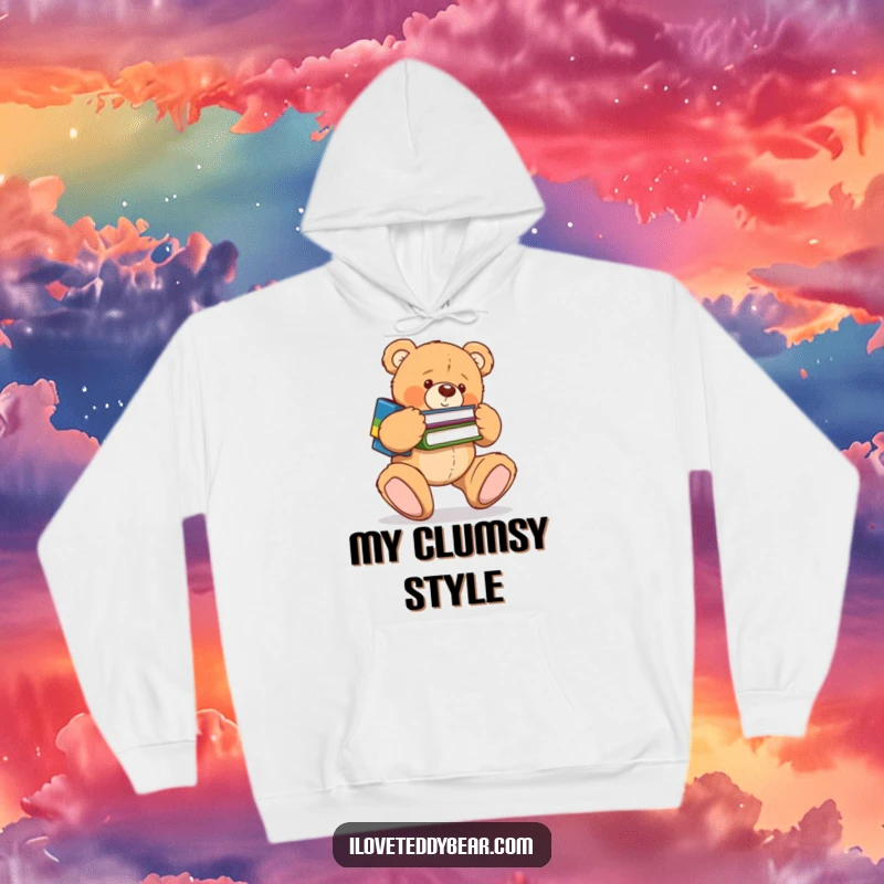 Funny hoodie depicting a clumsy teddy bear tripping over its large feet, scattering books in a humorous mishap. A great funny gift.