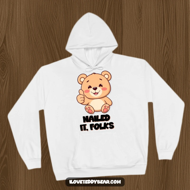 Funny hoodie with a teddy bear giving a thumbs up and a cheerful, toothy smile, offering warmth and positive energy.