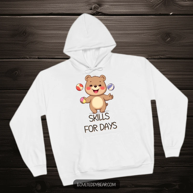 Funny hoodie depicting a jovial bear skillfully juggling colorful balls, designed for ultimate comfort and a good laugh.