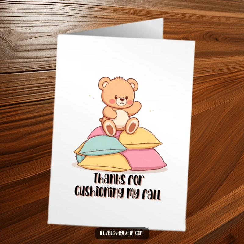 Funny Free Printable Thank You Card: A teddy bear happily trips onto a stack of fluffy pillows, a charming downloadable art.