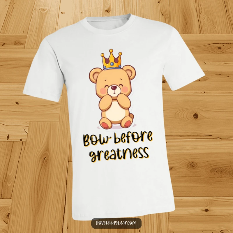 Funny t-shirt showing a teddy bear wearing a crown, bowing grandly, capturing a moment of dramatic and humorous regality.