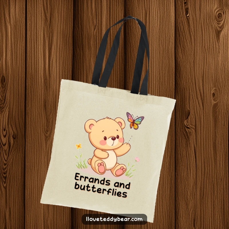 Funny tote bag featuring a teddy bear in playful pursuit of a bouncing butterfly, perfect for carrying treasures.