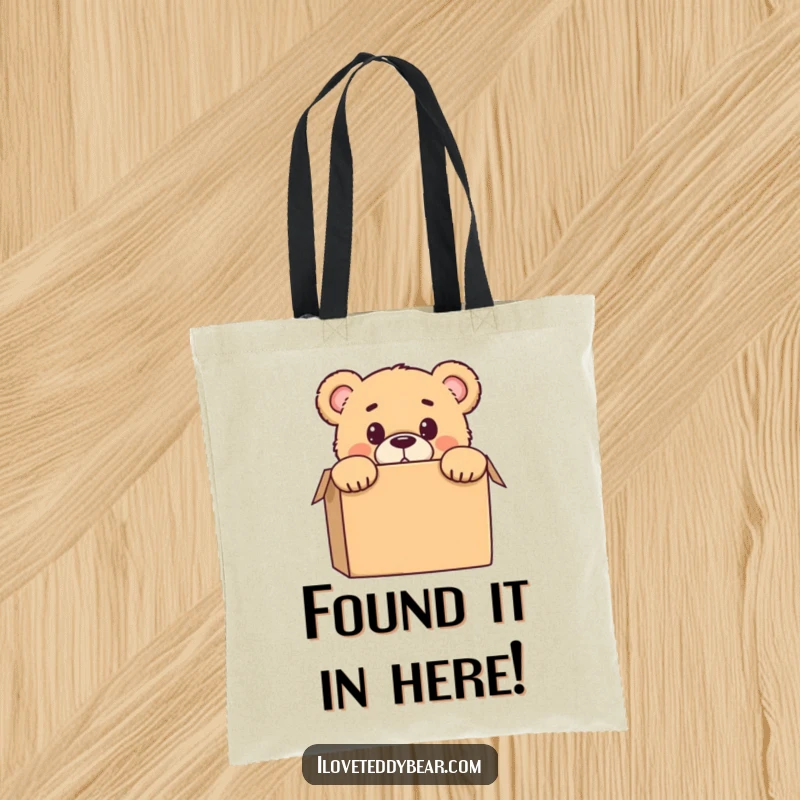 Funny tote bag with a teddy bear peeking from behind a box, showcasing a comical surprised look, suitable for carrying essentials.