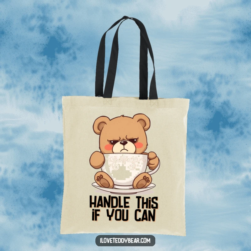 Funny tote bag showing a grumpy teddy bear comically failing to fit inside a small teacup, a humorous depiction. Great funny gift.